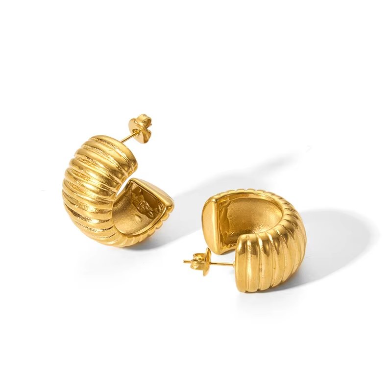 Gold Tyre style earrings